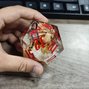 The Jaws of the Deceiver – 55mm Encapsulated Mimic D20 Dice - Nerd Gear Gaming Inc.